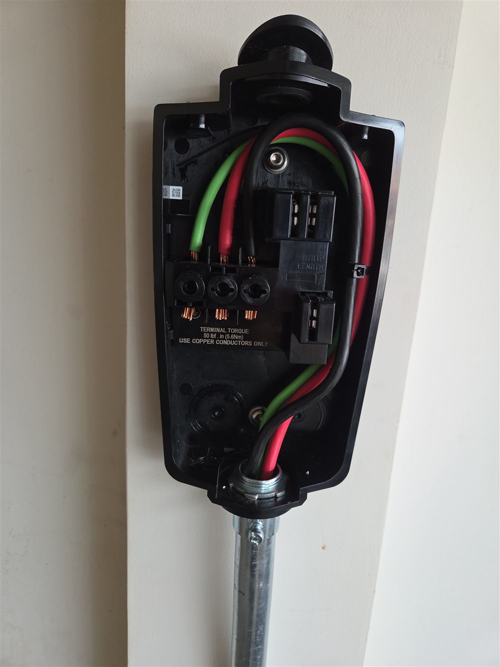 Tesla wall connector wired and ready for its cover