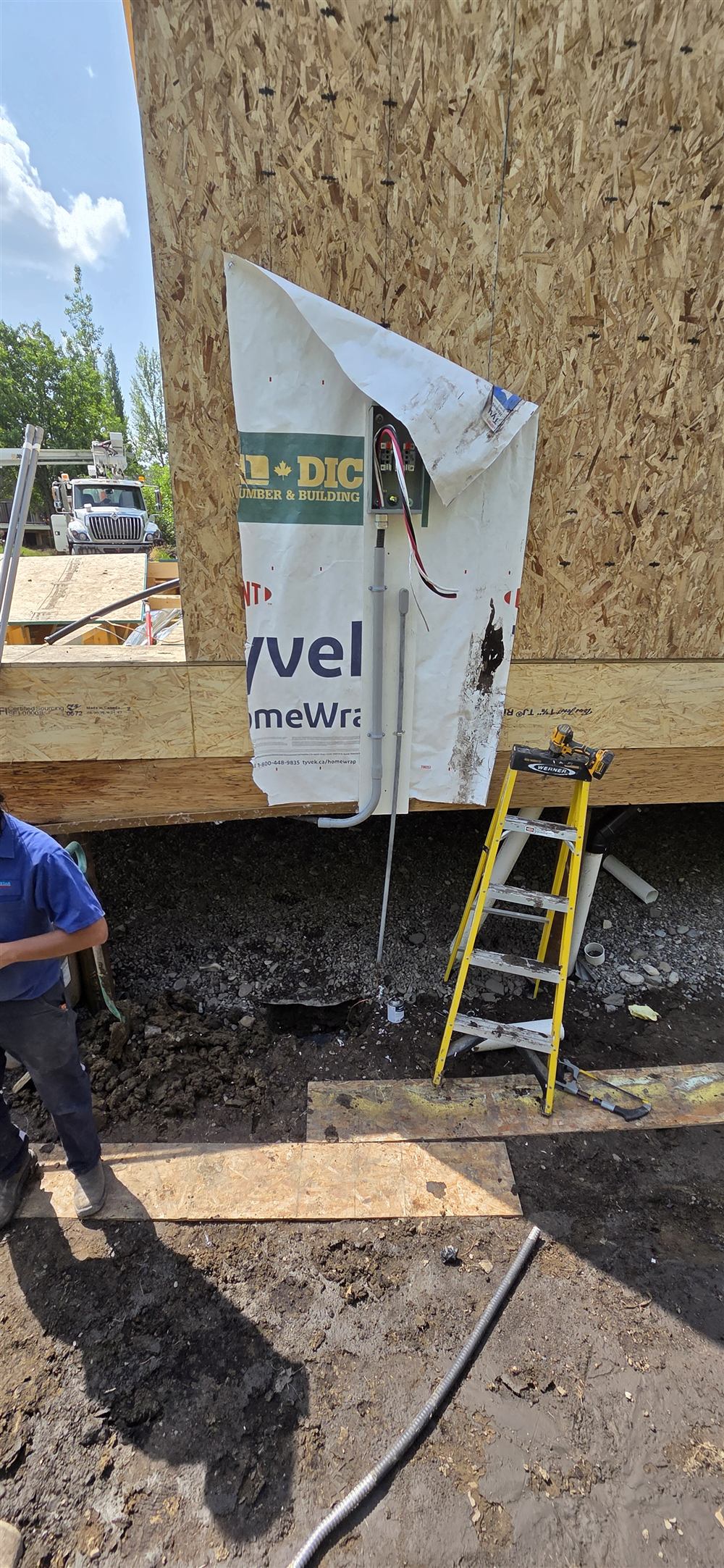 New electrical service being installed on a building under construction
